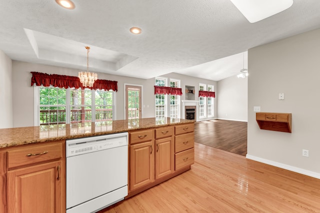 315 Rock Ridge Rd, Branson West, MO 65737 - kitchen featuring white dishwasher, light wood-type flooring, a chandelier, baseboards, and a textured ceiling
