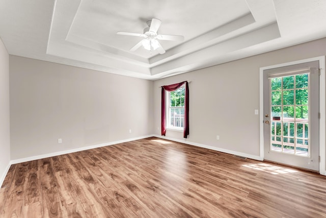 315 Rock Ridge Rd, Branson West, MO 65737 - unfurnished room with a raised ceiling, wood finished floors, baseboards, and ceiling fan