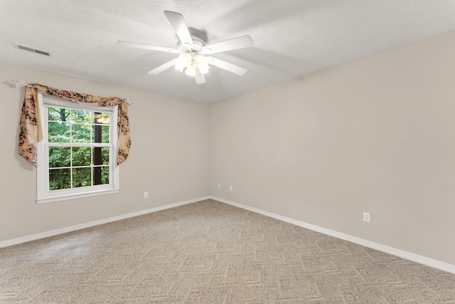 315 Rock Ridge Rd, Branson West, MO 65737 - spare room with ceiling fan, a textured ceiling, light carpet, and baseboards