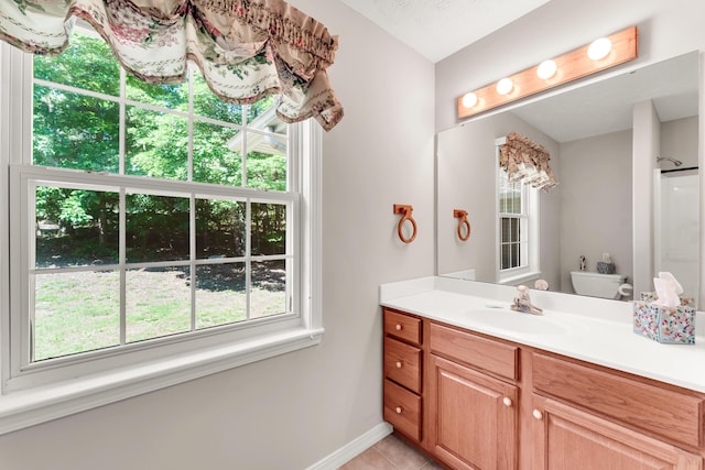 315 Rock Ridge Rd, Branson West, MO 65737 - full bath with vanity, baseboards, tile patterned floors, and a shower