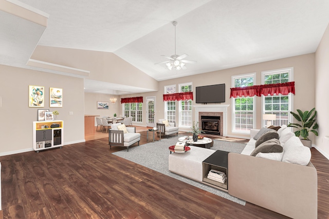 315 Rock Ridge Rd, Branson West, MO 65737 - living area featuring wood finished floors, plenty of natural light, ceiling fan, a tile fireplace, and vaulted ceiling