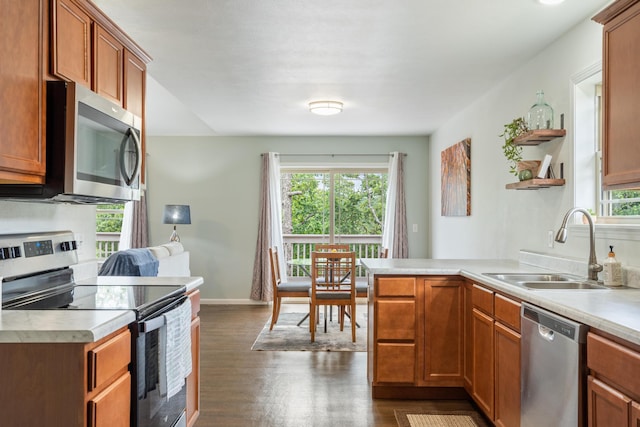 343 Cedar Glade Dr, Branson West, MO 65737 - kitchen with appliances with stainless steel finishes, a sink, a peninsula, and light countertops