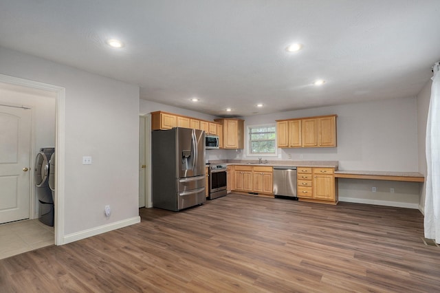 2304 S 12th St, Ozark, MO 65721 - kitchen with stainless steel appliances, a sink, light brown cabinets, baseboards, and dark wood finished floors