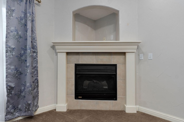 2304 S 12th St, Ozark, MO 65721 - detailed view of carpet flooring, baseboards, and a tile fireplace