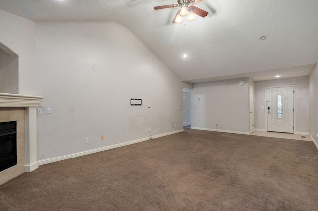2304 S 12th St, Ozark, MO 65721 - unfurnished living room featuring lofted ceiling, ceiling fan, carpet flooring, a tile fireplace, and recessed lighting