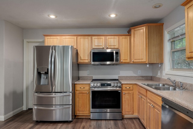 2304 S 12th St, Ozark, MO 65721 - kitchen with appliances with stainless steel finishes, a sink, dark wood-style floors, light countertops, and recessed lighting