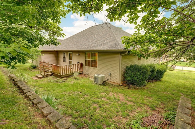 2304 S 12th St, Ozark, MO 65721 - back of property featuring a shingled roof, a wooden deck, a yard, and central air condition unit