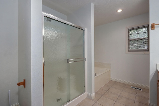 2304 S 12th St, Ozark, MO 65721 - full bath with a garden tub, a stall shower, tile patterned flooring, vanity, and recessed lighting