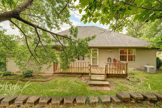 2304 S 12th St, Ozark, MO 65721 - back of house featuring a shingled roof, a deck, central AC, and a lawn