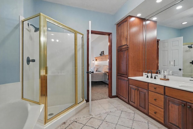 235 Lower Emerald Bay Cir Unit C-6, Hollister, MO 65672 - ensuite bathroom featuring a stall shower, double vanity, recessed lighting, and a bath