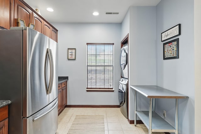 235 Lower Emerald Bay Cir Unit C-6, Hollister, MO 65672 - kitchen with freestanding refrigerator, stacked washer / drying machine, recessed lighting, light tile patterned flooring, and baseboards