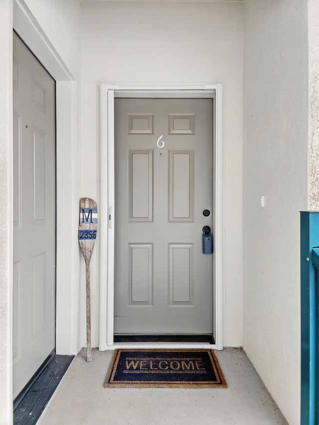 235 Lower Emerald Bay Cir Unit C-6, Hollister, MO 65672 - property entrance with stucco siding