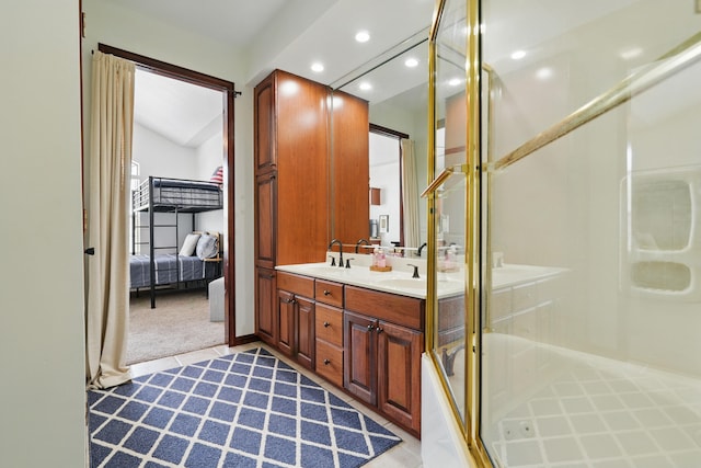 235 Lower Emerald Bay Cir Unit C-6, Hollister, MO 65672 - bathroom with double vanity, connected bathroom, recessed lighting, and an enclosed shower