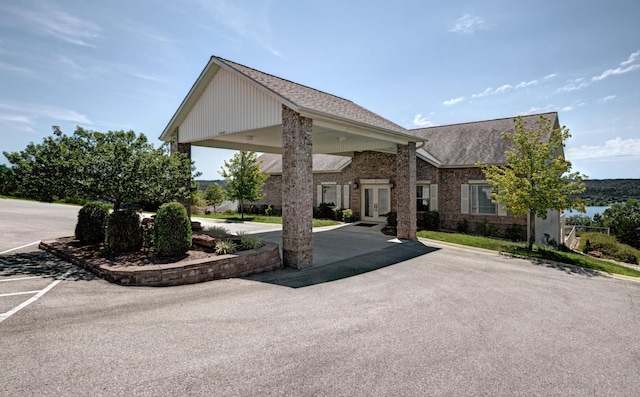 235 Lower Emerald Bay Cir Unit C-6, Hollister, MO 65672 - view of front of home with french doors, roof with shingles, and brick siding