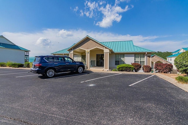 235 Lower Emerald Bay Cir Unit C-6, Hollister, MO 65672 - view of building exterior with uncovered parking