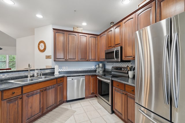 235 Lower Emerald Bay Cir Unit C-6, Hollister, MO 65672 - kitchen featuring stainless steel appliances, a sink, recessed lighting, light tile patterned floors, and backsplash