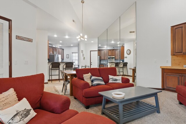 235 Lower Emerald Bay Cir Unit C-6, Hollister, MO 65672 - living room featuring recessed lighting, high vaulted ceiling, light carpet, and a chandelier