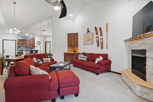 235 Lower Emerald Bay Cir Unit C-6, Hollister, MO 65672 - living area featuring light carpet, high vaulted ceiling, a fireplace, a chandelier, and a ceiling fan
