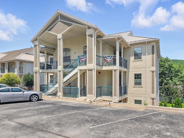 235 Lower Emerald Bay Cir Unit C-6, Hollister, MO 65672 - view of property with uncovered parking and stairway