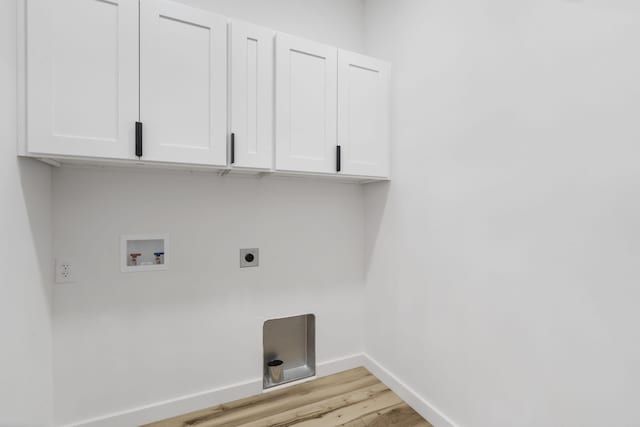 2048 N Sun Valley Dr, Springfield, MO 65802 - laundry room with cabinet space, hookup for an electric dryer, light wood-type flooring, washer hookup, and baseboards