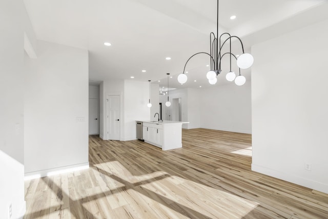 2048 N Sun Valley Dr, Springfield, MO 65802 - unfurnished living room with light wood-style floors, a chandelier, recessed lighting, a sink, and baseboards