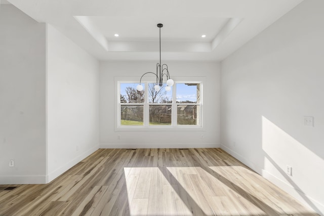 2048 N Sun Valley Dr, Springfield, MO 65802 - unfurnished dining area featuring light wood finished floors, a tray ceiling, a chandelier, baseboards, and recessed lighting