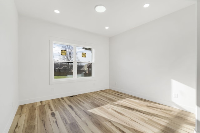 2048 N Sun Valley Dr, Springfield, MO 65802 - unfurnished room with wood finished floors, recessed lighting, and baseboards