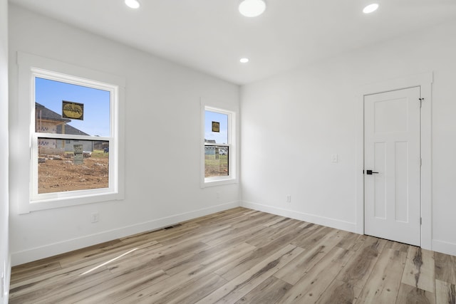 2048 N Sun Valley Dr, Springfield, MO 65802 - empty room with wood finished floors, baseboards, and recessed lighting