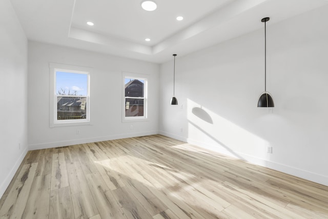 2048 N Sun Valley Dr, Springfield, MO 65802 - unfurnished room featuring light wood-style floors, baseboards, a raised ceiling, and recessed lighting