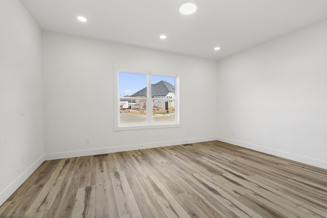 2048 N Sun Valley Dr, Springfield, MO 65802 - empty room with light wood-type flooring, baseboards, and recessed lighting