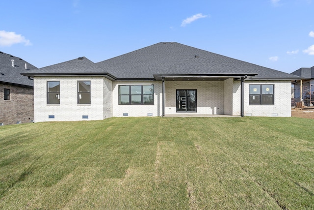2048 N Sun Valley Dr, Springfield, MO 65802 - rear view of house with brick siding, crawl space, and a lawn