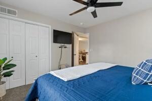 151 Highland Dr Unit 3, Branson, MO 65616 - carpeted bedroom featuring a closet and ceiling fan