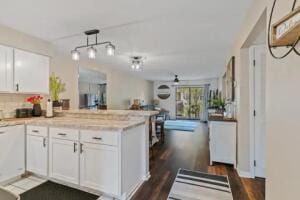 151 Highland Dr Unit 3, Branson, MO 65616 - kitchen featuring a peninsula, white cabinets, light countertops, and open floor plan