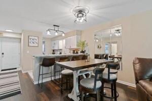 151 Highland Dr Unit 3, Branson, MO 65616 - dining space featuring baseboards and dark wood-style floors
