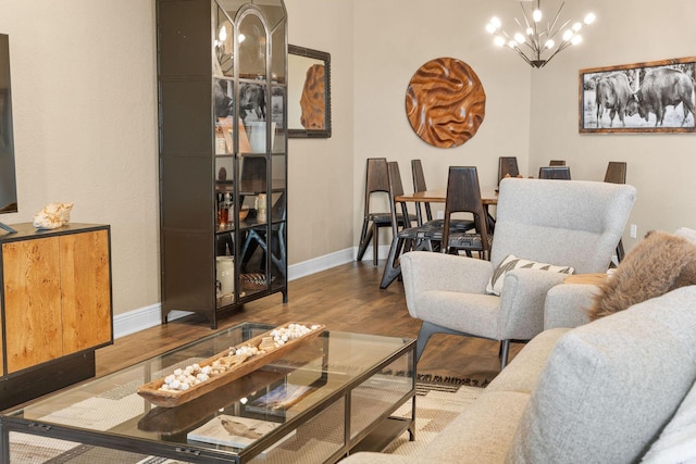 130 Royal Vista Dr Unit 601, Branson, MO 65616 - living room featuring a chandelier, wood finished floors, and baseboards