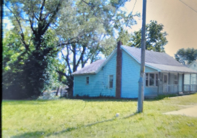 1208 W Fair Play St, Bolivar, MO 65613 - view of property exterior with a lawn