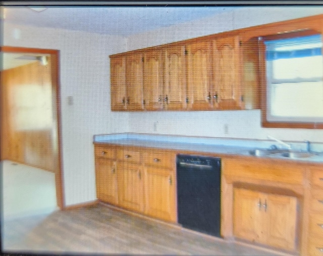1208 W Fair Play St, Bolivar, MO 65613 - kitchen with brown cabinetry and light countertops