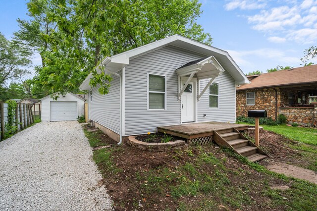 1211 S Pennsylvania Ave, Springfield, MO 65807 - view of front of home with driveway, an outdoor structure, and a garage