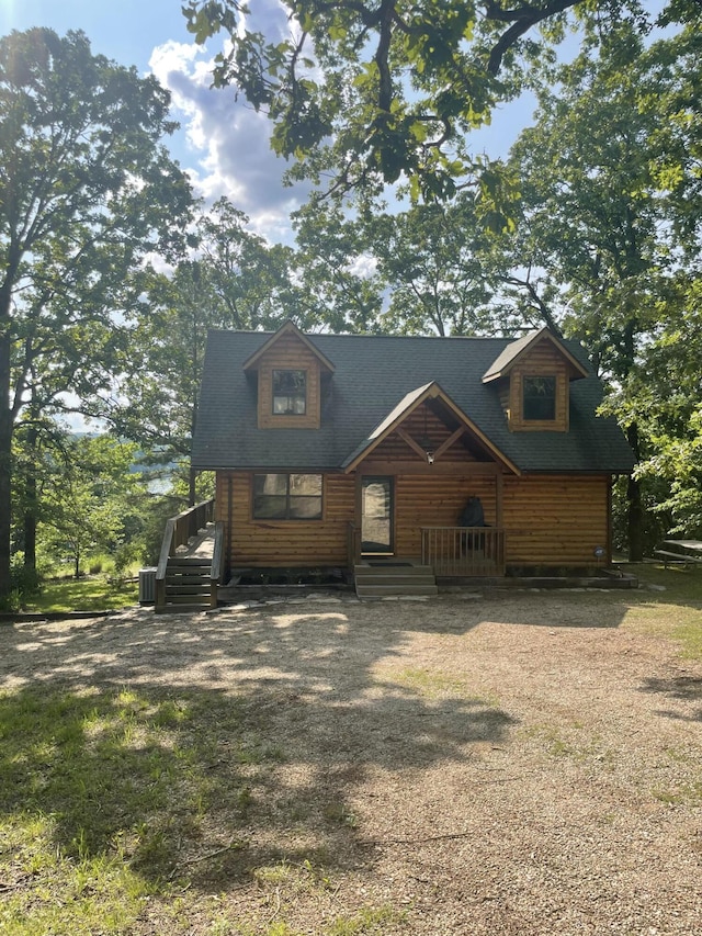 28069 Farm Rd Unit 1198, Eagle Rock, MO 65641 - view of front of house with covered porch and faux log siding