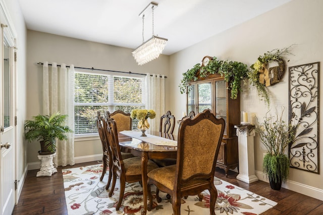 94 W Pine Ln, Reeds Spring, MO 65737 - dining space featuring hardwood / wood-style floors, baseboards, and a chandelier