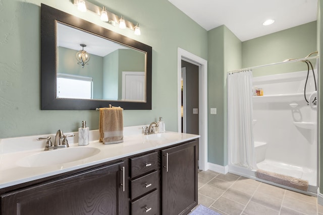 94 W Pine Ln, Reeds Spring, MO 65737 - bathroom with a shower with curtain, double vanity, tile patterned flooring, and baseboards