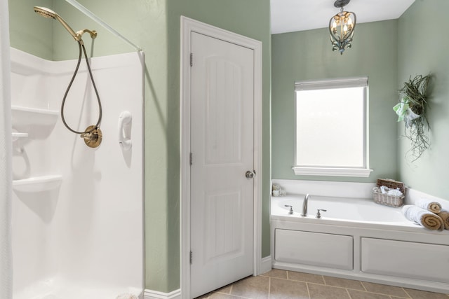94 W Pine Ln, Reeds Spring, MO 65737 - bathroom featuring a stall shower, a garden tub, and tile patterned flooring