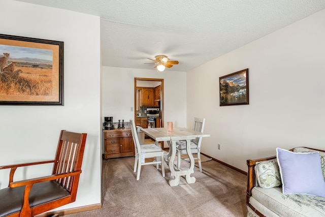 2711 E Stanford St, Springfield, MO 65804 - dining space featuring light carpet, ceiling fan, and baseboards