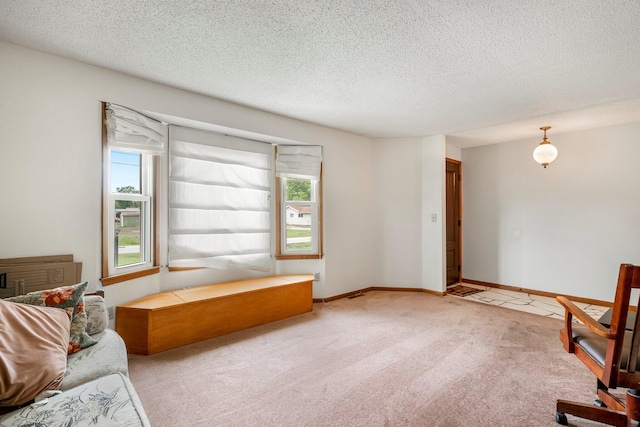 2711 E Stanford St, Springfield, MO 65804 - unfurnished room with carpet flooring, a textured ceiling, and baseboards