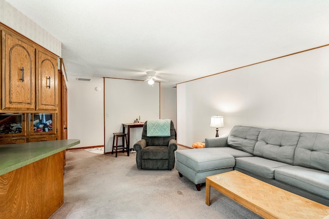 2711 E Stanford St, Springfield, MO 65804 - living room with ceiling fan and light colored carpet