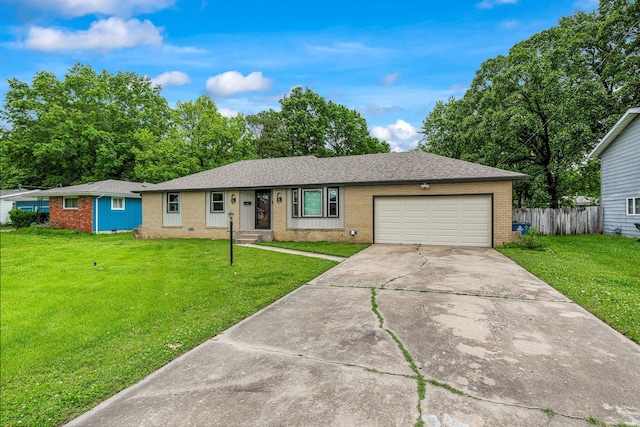 2711 E Stanford St, Springfield, MO 65804 - ranch-style home with brick siding, a garage, concrete driveway, and a shingled roof