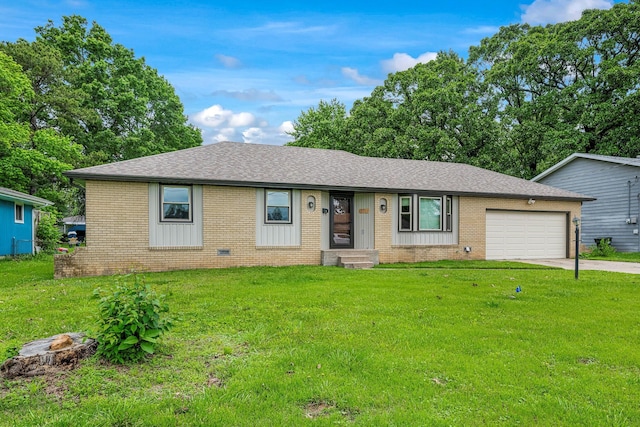 2711 E Stanford St, Springfield, MO 65804 - single story home featuring roof with shingles, brick siding, a garage, driveway, and a front yard