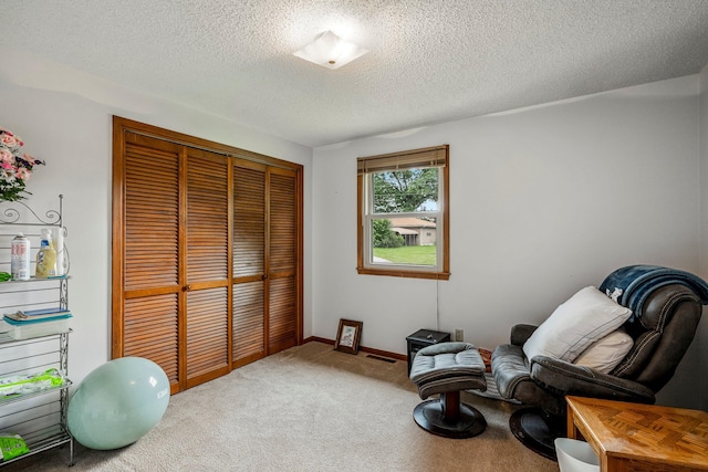 2711 E Stanford St, Springfield, MO 65804 - sitting room with carpet flooring and a textured ceiling