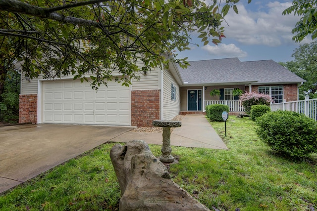 326 Country Bluff Dr, Branson, MO 65616 - traditional-style house with brick siding, concrete driveway, covered porch, a front lawn, and an attached garage