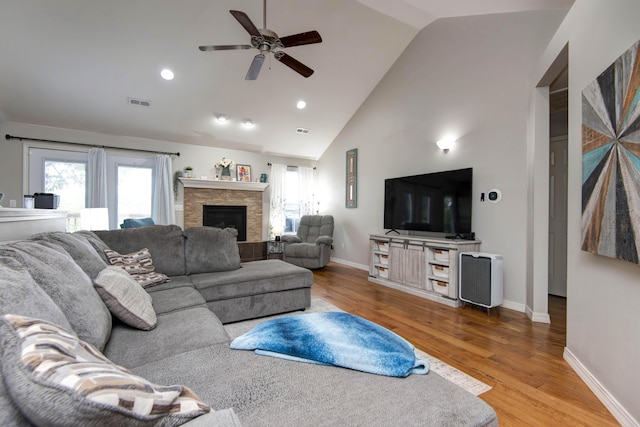326 Country Bluff Dr, Branson, MO 65616 - living area with a ceiling fan, a stone fireplace, wood finished floors, healthy amount of natural light, and recessed lighting